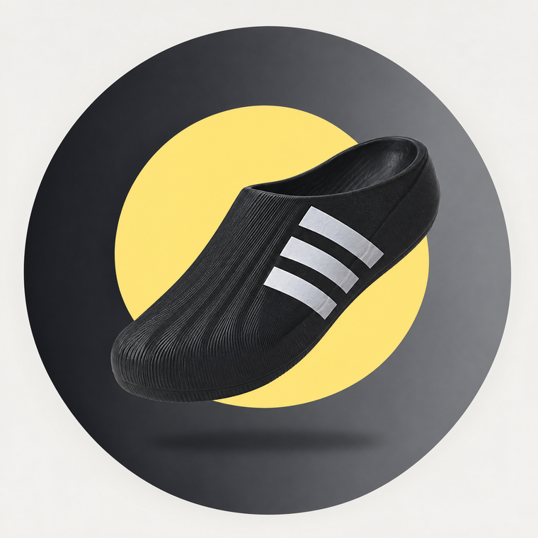 Adifom Superstar clog in black on a charcoal colour-blocked circle
